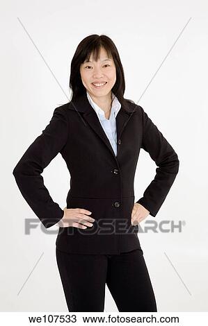 Beautiful Asain Businesswoman posing on a white background View Large Photo Image Stock Image - Beautiful Asain Businesswoman posing on a white background. Fotosearch