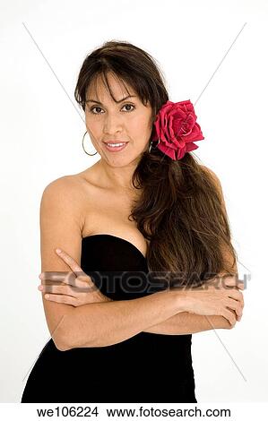 Beautiful Brazilian or Hispanic woman in a black evening gown on a white background View Large Photo Image Picture - Beautiful Brazilian or Hispanic woman in a black evening gown on a white background. Fotosearch