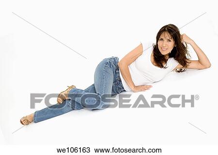 Stock Image - Beautiful Brazilian or Hispanic woman in casual clothes on a white background. Fotosearch