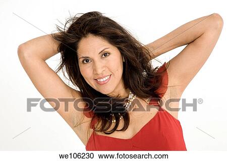 Beautiful Brazilian or Hispanic woman in a red evening gown on a white background View Large Photo Image Stock Image - Beautiful Brazilian or Hispanic woman in a red evening gown on a white background. Fotosearch