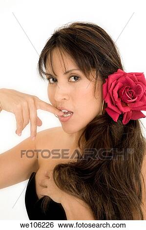 Stock Photograph - Beautiful Brazilian or Hispanic woman in a black evening gown on a white background. Fotosearch