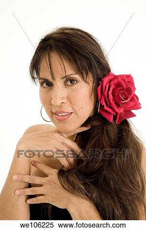 Beautiful Brazilian or Hispanic woman in a black evening gown on a white background View Large Photo Image Stock Photography - Beautiful Brazilian or Hispanic woman in a black evening gown on a white background. Fotosearch
