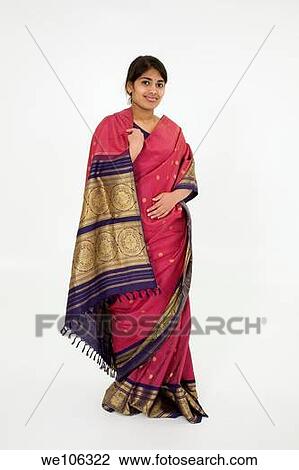 Beautiful Hindu teenager dressed in a traditional Sari dress View Large Photo Image Stock Image - Beautiful Hindu teenager dressed in a traditional Sari dress. Fotosearch