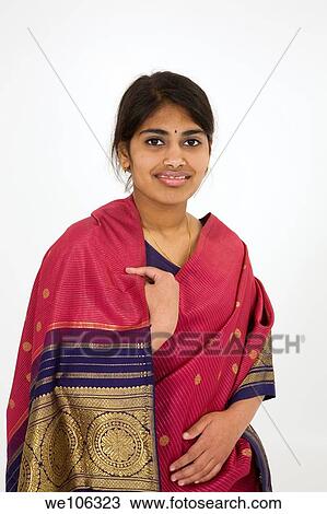 Beautiful Hindu teenager dressed in a traditional Sari dress View Large Photo Image Stock Image - Beautiful Hindu teenager dressed in a traditional Sari dress. Fotosearch