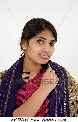 Beautiful Hindu teenager dressed in a traditional Sari dress View Large Photo Image Stock Photo - Beautiful Hindu teenager dressed in a traditional Sari dress. Fotosearch