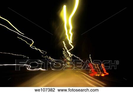 Blurred tail lights of highway traffic at night View Large Photo Image Stock Image - Blurred tail lights of highway traffic at night. Fotosearch