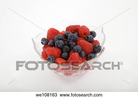 Bowl of Raspberries and blueberries on white background View Large Photo Image Stock Image - Bowl of Raspberries and blueberries on white background. Fotosearch