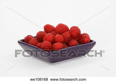 Stock Photo - Bowl of raspberries on white background. Fotosearch