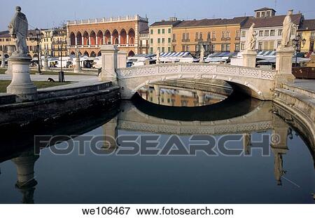 Stock Photo - Canal through the Prato della Valle with Loggia Amulea in the background, Padua, Italy. Fotosearch