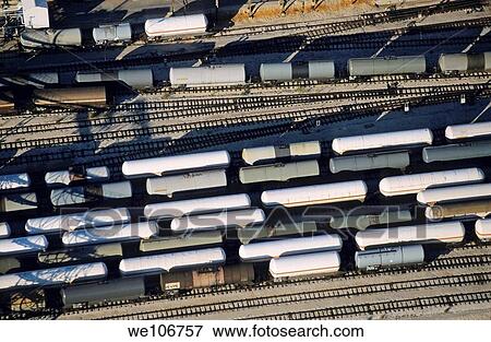 Carriages of freight trains on a commercial railway View Large Photo Image Stock Photo - Carriages of freight trains on a commercial railway. Fotosearch