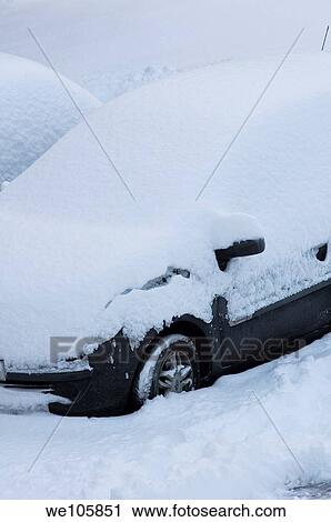 Stock Image - Cars buried by heavy snow falls in Worcestershire, England December 2010. Fotosearch