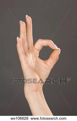 Caucasian female using hand gestures to say ok View Large Photo Image Stock Photo - Caucasian female using hand gestures to say ok. Fotosearch