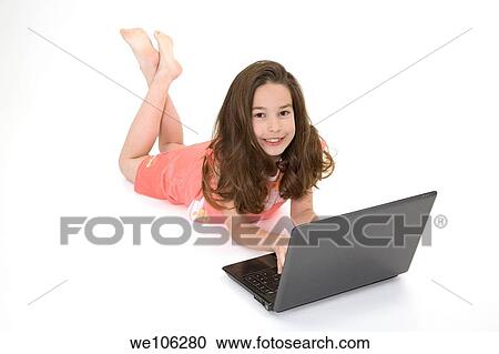 Child playing on a laptop computer on a white background View Large Photo Image Stock Image - Child playing on a laptop computer on a white background. Fotosearch