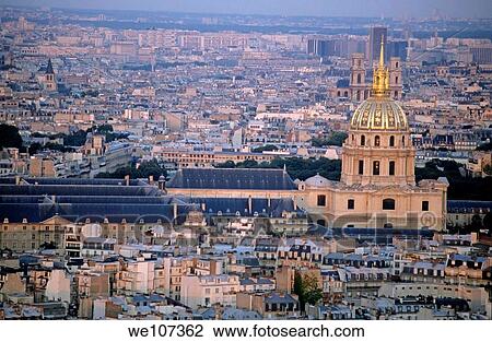 Stock Image - City buildings at sunset as seen from the Arc de Triomphe including Les Invalides, Paris, France. Fotosearch