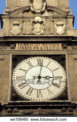 Clock and inscription on a tower, Milan, Italy View Large Photo Image Stock Photography - Clock and inscription on a tower, Milan, Italy. Fotosearch