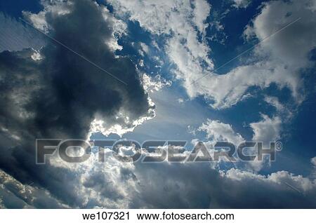 Clouds and sunlight in the sky following a storm, France View Large Photo Image Stock Image - Clouds and sunlight in the sky following a storm, France. Fotosearch