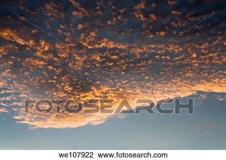 Stock Image - Clouds at Sunset. Fotosearch