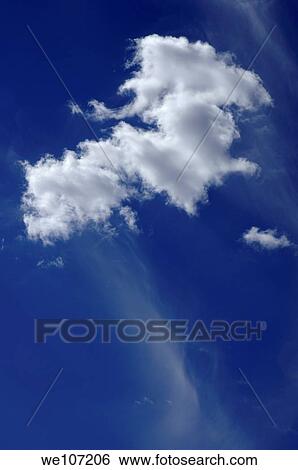 Clouds in a beautiful blue, sunny sky View Large Photo Image Stock Photograph - Clouds in a beautiful blue, sunny sky. Fotosearch