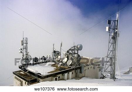 Stock Photograph - Communication towers on top of a mountain in the French Alps, Chamrousse, France. Fotosearch