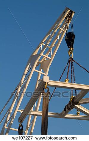 Crane at a waterfront dock View Large Photo Image Stock Photo - Crane at a waterfront dock. Fotosearch