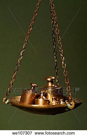 Different sized copper weights on a scale View Large Photo Image Stock Photo - Different sized copper weights on a scale. Fotosearch