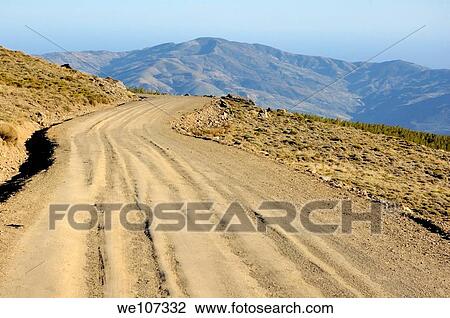 Dirt road winding above Capileira village in the Alpujarras mountains, Andalusia, Spain View Large Photo Image Stock Image - Dirt road winding above Capileira village in the Alpujarras mountains, Andalusia, Spain. Fotosearch