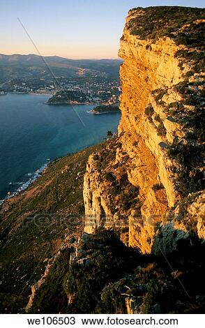 Dramatic rock face of Cape Canaille at sunset, Cassis, France View Large Photo Image Stock Image - Dramatic rock face of Cape Canaille at sunset, Cassis, France. Fotosearch