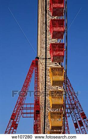 Empty carriages of a ferris wheel in an amusement park on a sunny day View Large Photo Image Stock Image - Empty carriages of a ferris wheel in an amusement park on a sunny day. Fotosearch