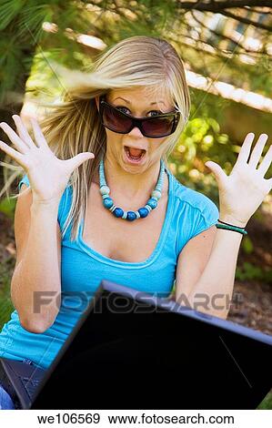 Excited teenage girl working on laptop computer View Large Photo Image Stock Photo - Excited teenage girl working on laptop computer. Fotosearch