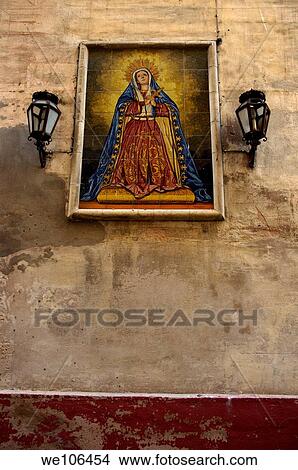 Faience mural depicting the Virgin Mary on a wall in the suburb of Barrio de Santa Cruz in Seville, Andalusia, Spain View Large Photo Image Picture - Faience mural depicting the Virgin Mary on a wall in the suburb of Barrio de Santa Cruz in Seville, Andalusia, Spain. Fotosearch