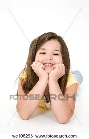 Five year old female child laying on white background smiling wearing casual clothes View Large Photo Image Stock Photography - Five year old female child laying on white background smiling wearing casual clothes. Fotosearch