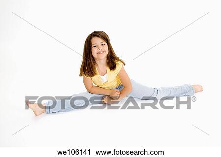 Five year old female child sitting on white background smiling wearing casual clothes View Large Photo Image Stock Image - Five year old female child sitting on white background smiling wearing casual clothes. Fotosearch