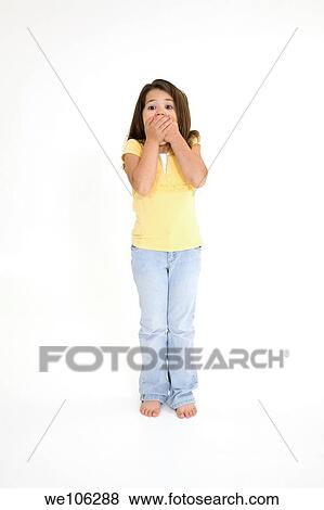 Stock Photo - Five year old female child standing on white background with a surprised look wearing casual clothes. Fotosearch