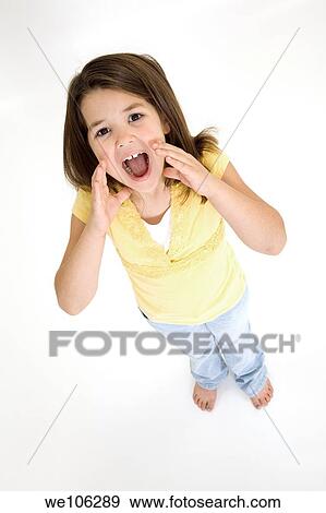 Five year old female child standing on white background shouting and wearing casual clothes View Large Photo Image Stock Photo - Five year old female child standing on white background shouting and wearing casual clothes. Fotosearch