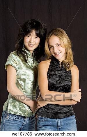 Stock Photograph - Friends posing for a portrait. Fotosearch