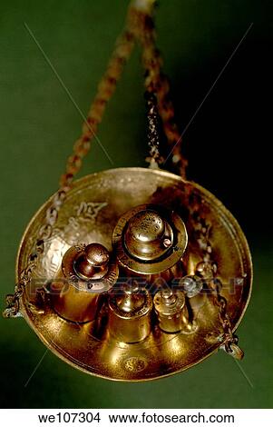 Group of French copper weights hanging on a scale View Large Photo Image Picture - Group of French copper weights hanging on a scale. Fotosearch