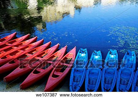 Kayaks lined up along the Lot riverbank at sunset, Puy-l´Évêque, Lot, France View Large Photo Image Stock Photo - Kayaks lined up along the Lot riverbank at sunset, Puy-l´Évêque, Lot, France. Fotosearch