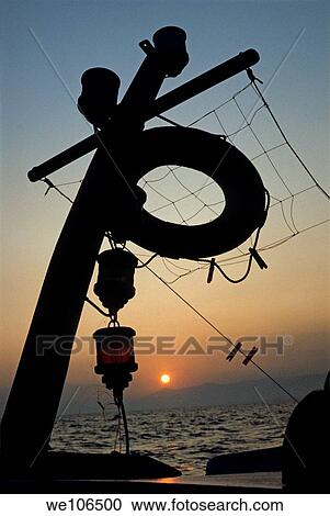 Lifebuoy silhouetted on a fishing boat at sunset, Greece View Large Photo Image Stock Image - Lifebuoy silhouetted on a fishing boat at sunset, Greece. Fotosearch