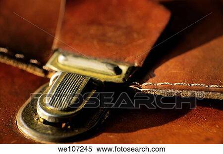 Stock Photography - Metal clasp on an old leather satchel. Fotosearch