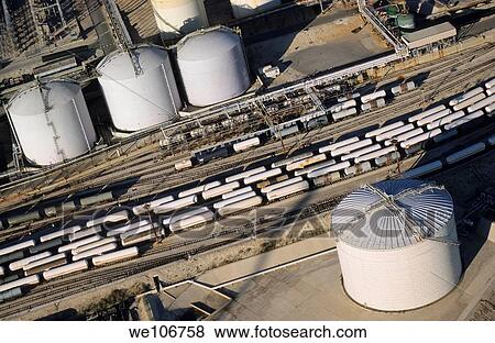 Oil tank and trains on railroad tracks, Lavera, France View Large Photo Image Stock Photo - Oil tank and trains on railroad tracks, Lavera, France. Fotosearch