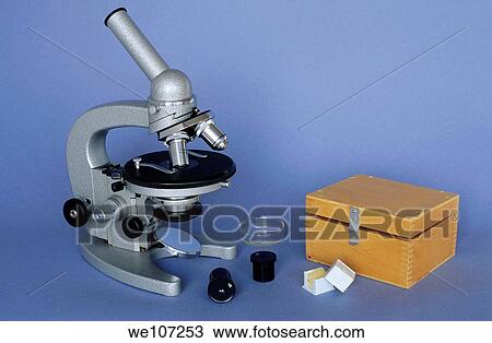 Stock Image - Optical microscope and accessories. Fotosearch