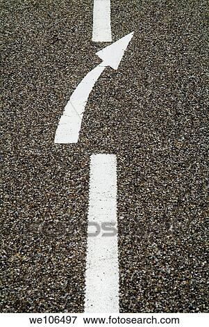 Painted white arrow sign in the dividing line on the road View Large Photo Image Stock Photo - Painted white arrow sign in the dividing line on the road. Fotosearch