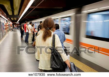 Passengrs get ready to ride the subway in Rome, Italy/ View Large Photo Image Stock Photography - Passengrs get ready to ride the subway in Rome, Italy/. Fotosearch