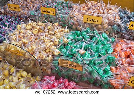 Stock Image - Piles of colorful lollipops in a sweet shop, Carcassonne, France. Fotosearch