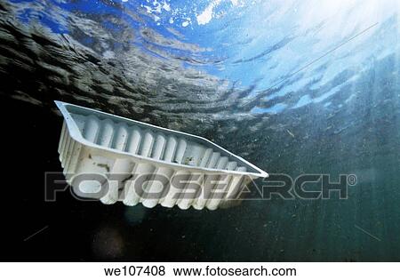 Stock Photo - Plastic container floating underwater, Marseille, France. Fotosearch