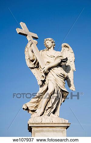 Ponte Saint Angelo bridge statue by Giovanni Bernini Rome Italy View Large Photo Image Stock Photo - Ponte Saint Angelo bridge statue by Giovanni Bernini Rome Italy. Fotosearch