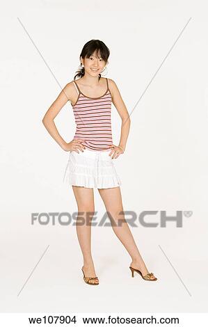 Portrait of a beautiful Asian teenager on a white background View Large Photo Image Picture - Portrait of a beautiful Asian teenager on a white background. Fotosearch