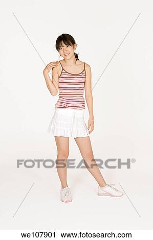 Portrait of a beautiful Asian teenager on a white background View Large Photo Image Stock Image - Portrait of a beautiful Asian teenager on a white background. Fotosearch