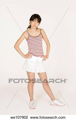 Portrait of a beautiful Asian teenager on a white background View Large Photo Image Stock Image - Portrait of a beautiful Asian teenager on a white background. Fotosearch