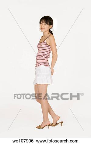 Portrait of a beautiful Asian teenager on a white background View Large Photo Image Stock Photograph - Portrait of a beautiful Asian teenager on a white background. Fotosearch